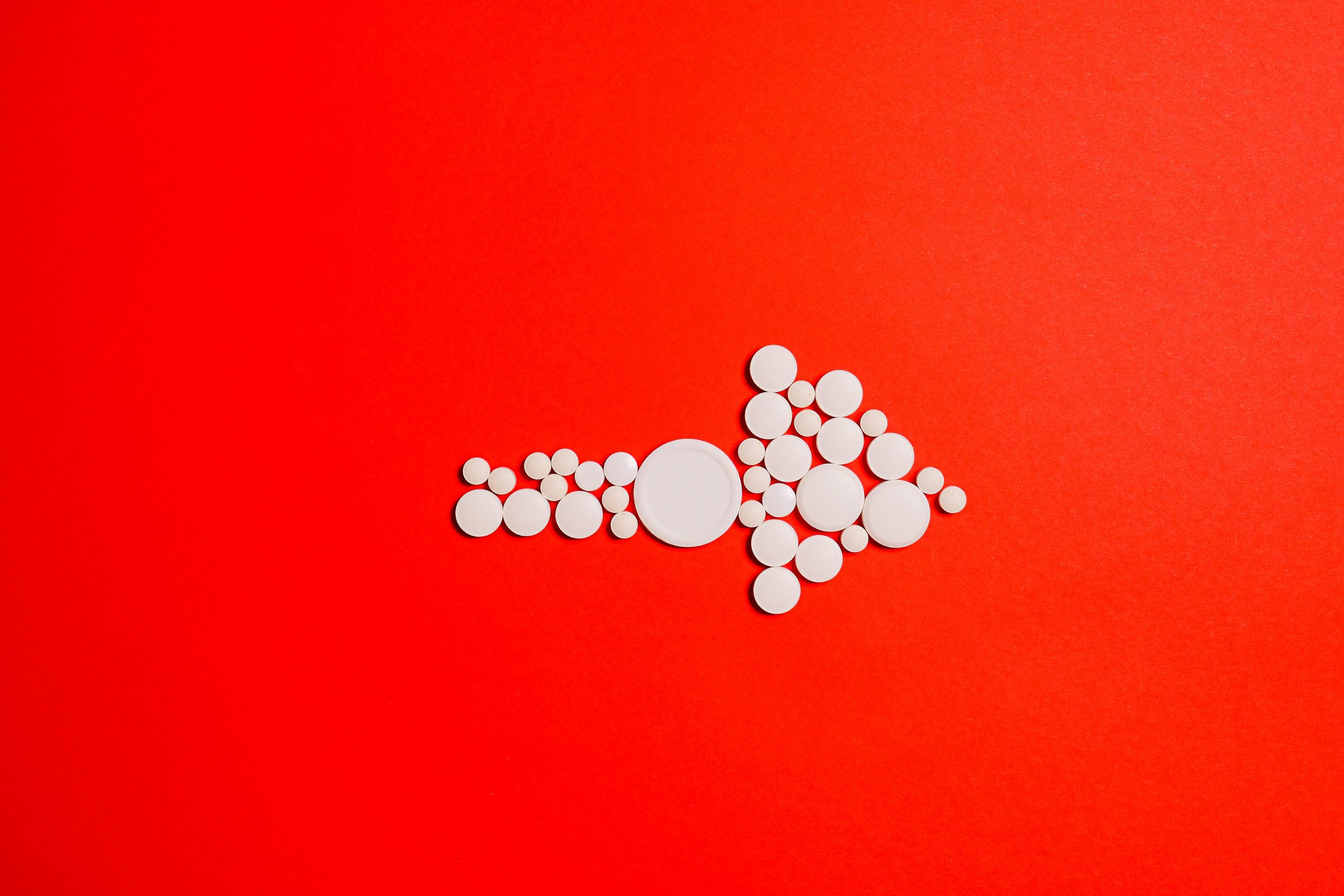 An arrow made up of pills