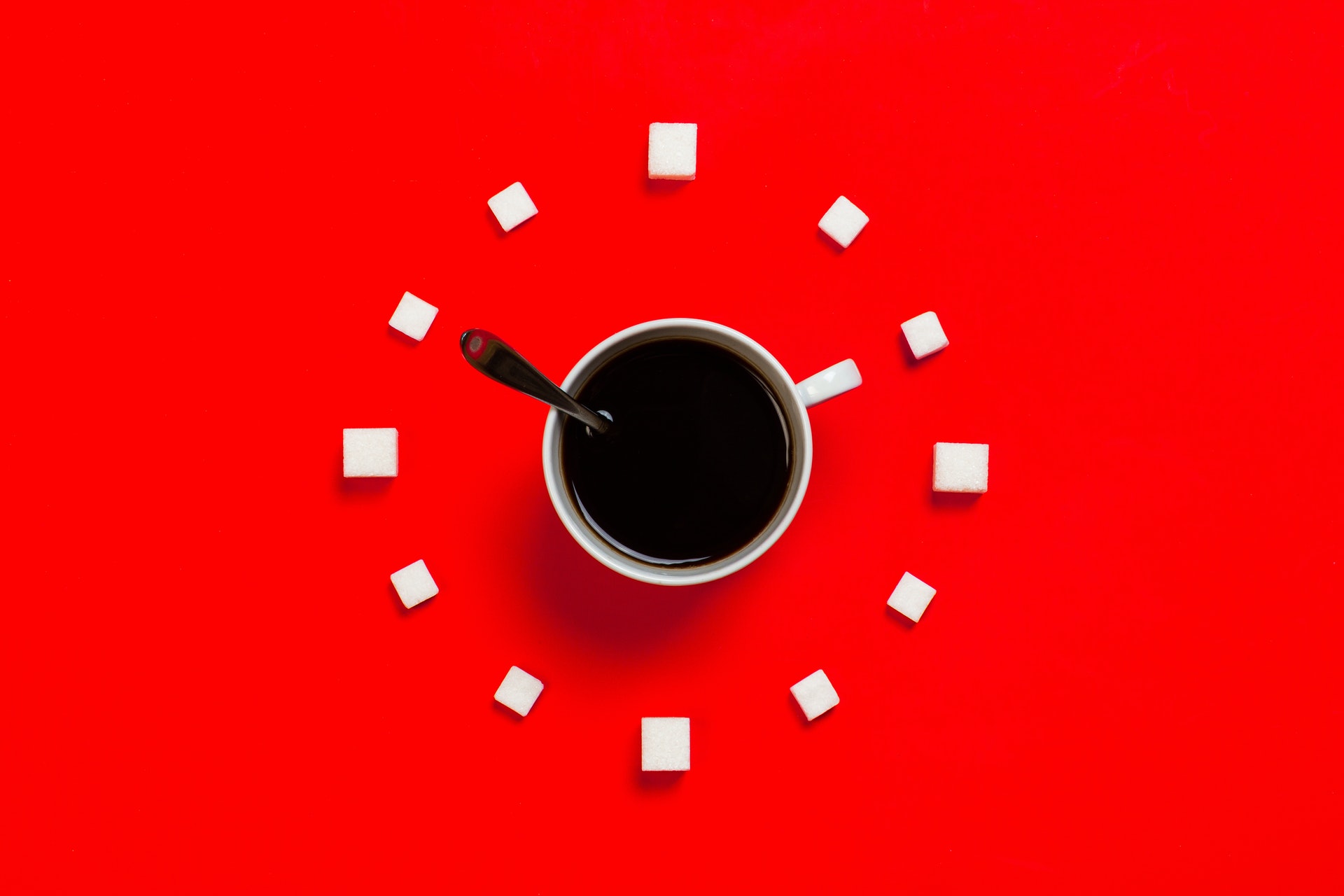 a coffee cup with sugar around like a clock