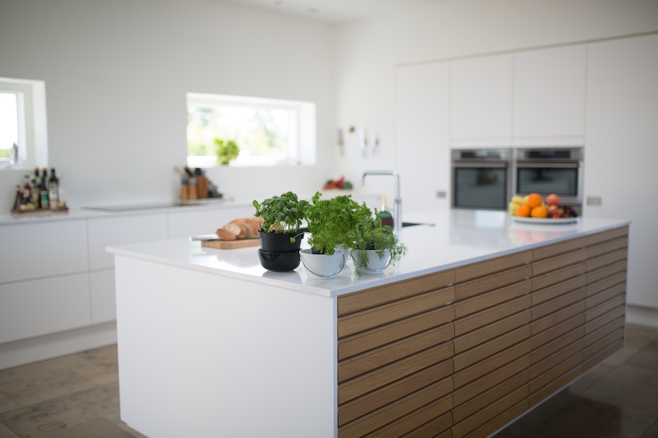modern white kitchen with island in the middle