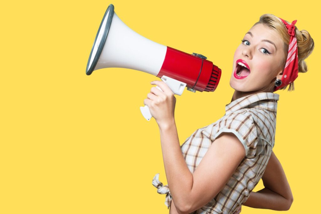 A woman speaking into a megaphone